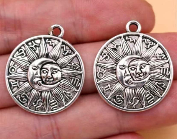 M0734  Set of TWO (2) Silver Plated Aluminum Metal Tribal Sun Charms/Pendant’s