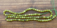 B9366   ONE (1) FULL Strand of Green Garnet Beads