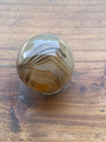 G1850  ONE (1) Small Sardonyx Polished Sphere With Holder