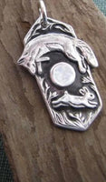 J1221   ONE (1) Stainless Steel Metal Coyote/Hare Scene Pendant