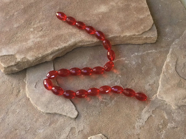 B3960   FULL Strand of Faceted Glass Oval Beads “Red”