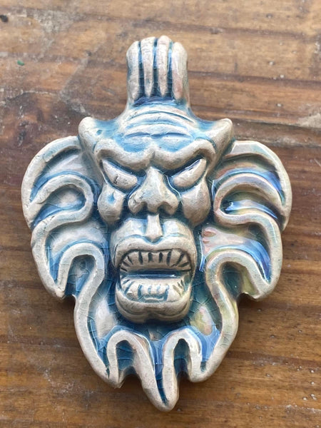 P5133  ONE (1) Raku Glazed Ceramic Pendant “Tiki Face”