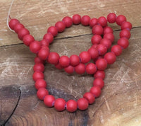 B0964 Red Rubberized Material over a Glass Bead Strand