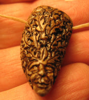 P4449  Hand Carved Greenman Tooth Pendant