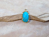 P1561   Howlite Turquoise set in Brass Pendant