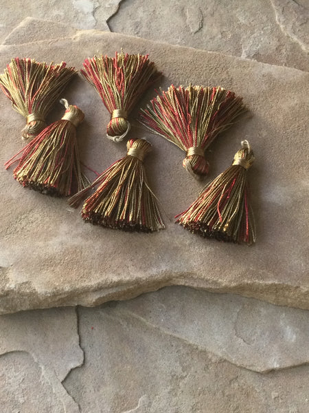 P1596  ONE (1) 1.5” Long Fabric/String Tassel “Red/Gold/Tans”